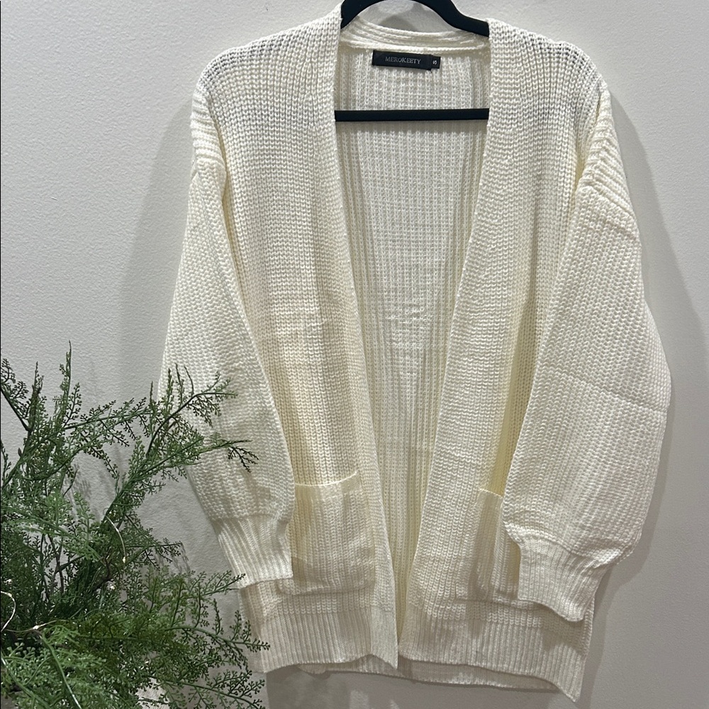 Stay warm and cozy in this cream color open front cardigan (never worn)!